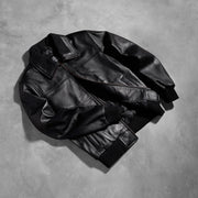 Styled Fit Perspective of Men's Air Rolf أسود جاكيت بومبر جلد رجالي on Model - Natural Daylight Drape