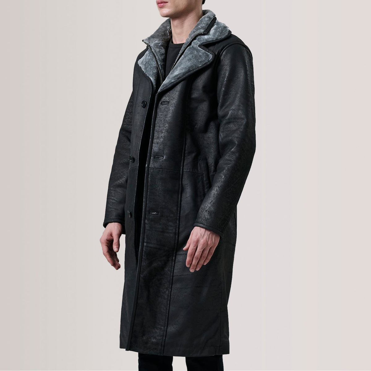 Cai Distressed Black Leather Shearling Coat For Men - Lateral Side Profile View Showing Sleeve Cut & Athletic Taper Fit