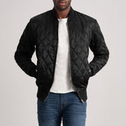 
Black Satin Varsity Jacket - عرض خلفي يوضح تفصيل الأكتاف المتقن والحاشية النظيفة