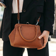 Tailored Rib Cuffs &amp; Hem Craftsmanship Construction Detail on Chili Full-Grain Leather Handbag نسائي