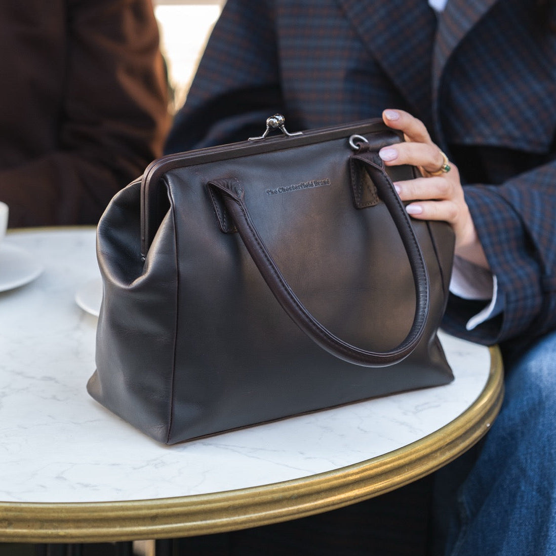 Styled Fit Perspective of Dorin Full-Grain Leather Handbag نسائي on Model - Natural Daylight Drape