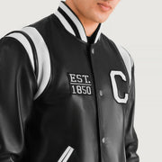 Close-Up Detail of Varsity &amp; Snap Button Hardware on Liberte California أسود Leather Varsity جاكيت جلد رجالي
