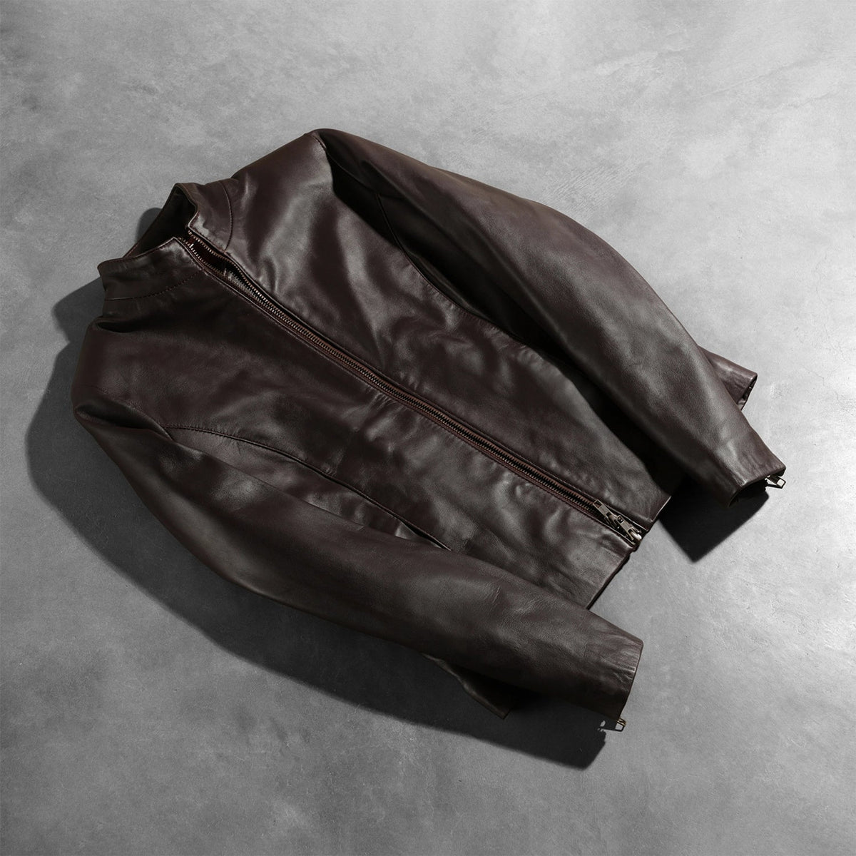 
Zipper & Hem Craftsmanship Construction Detail on Rumella Maroon Leather Biker Jacket